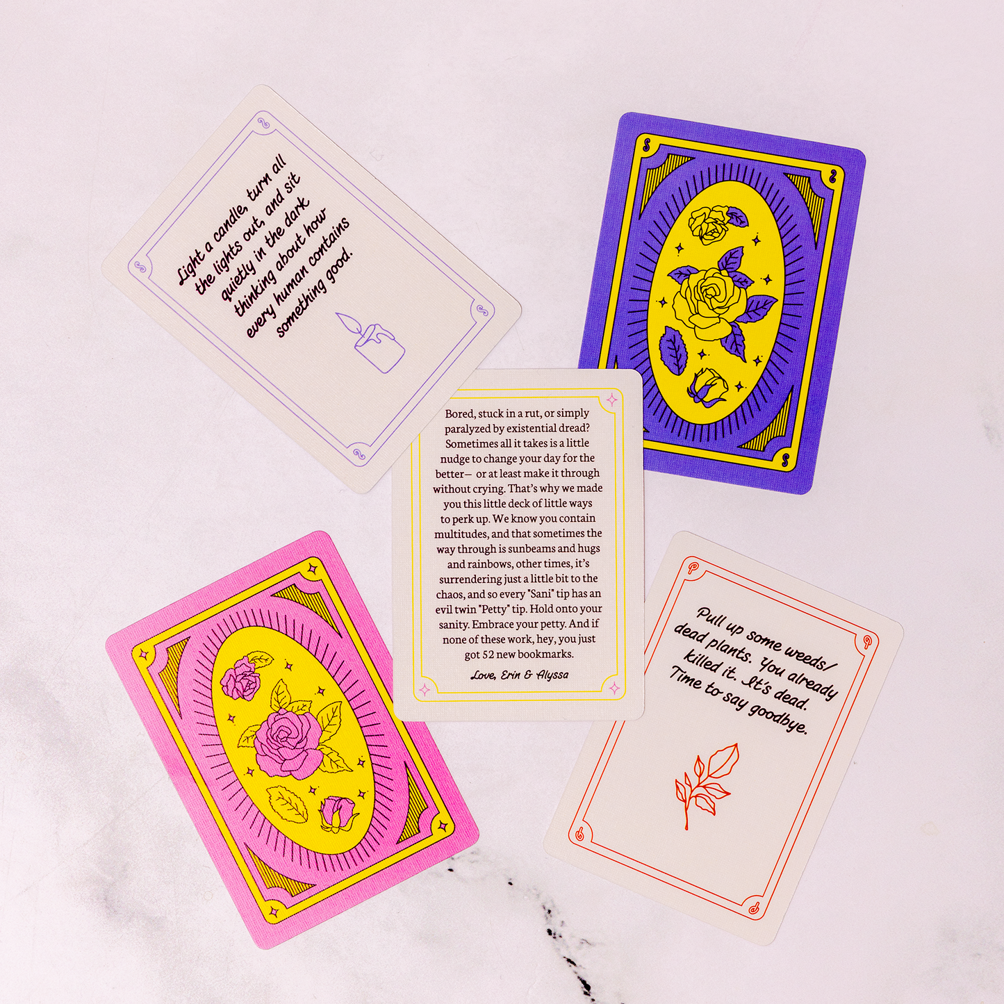 Colorful tarot cards with text and symbols on a white background