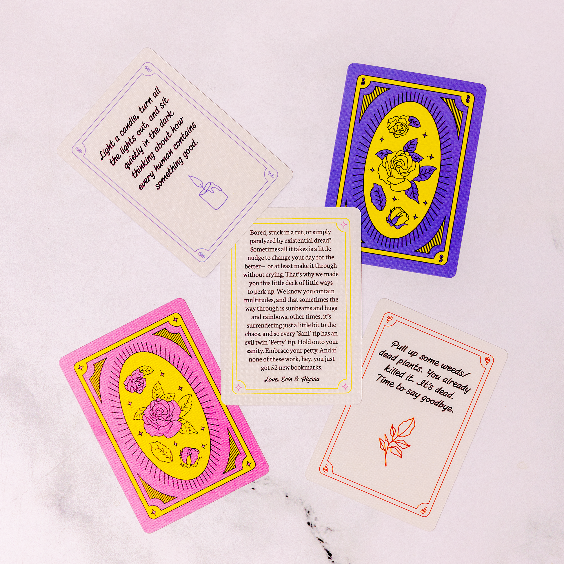 Colorful tarot cards with text and symbols on a white background