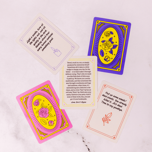 Colorful tarot cards with text and symbols on a white background