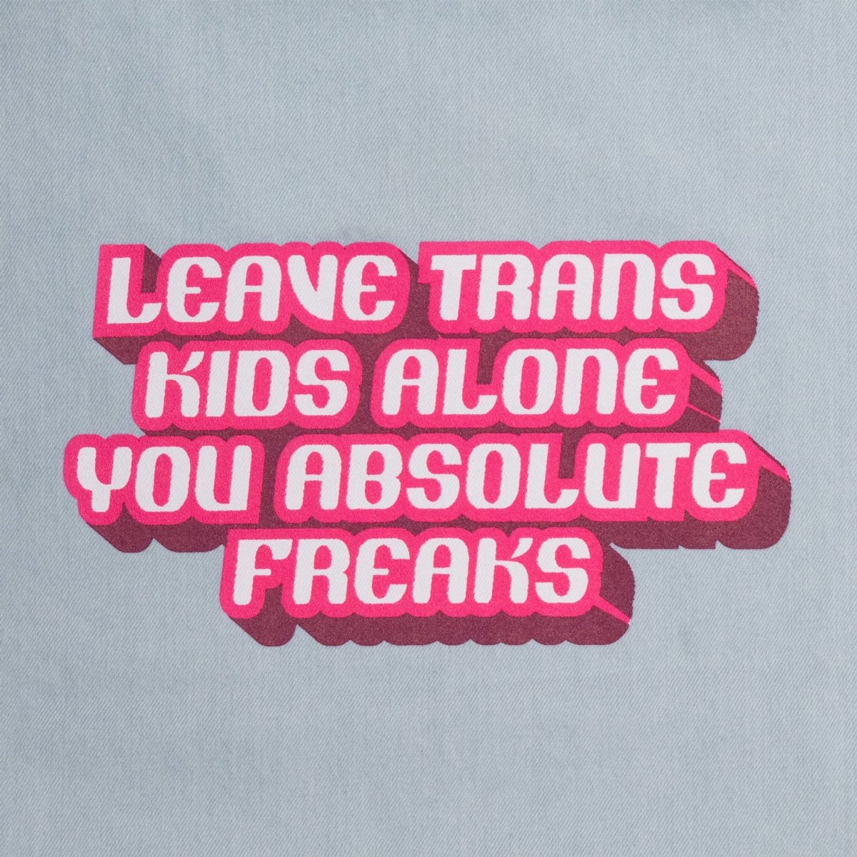 Crooked Leave Trans Kids Alone Denim Tote Bag with Pink Writing Close Up