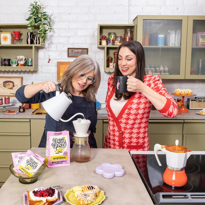 Alyssa and Erin making Crooked Coffee Hysteria Petty Brew Medium Roast Coffee in the kitchen
